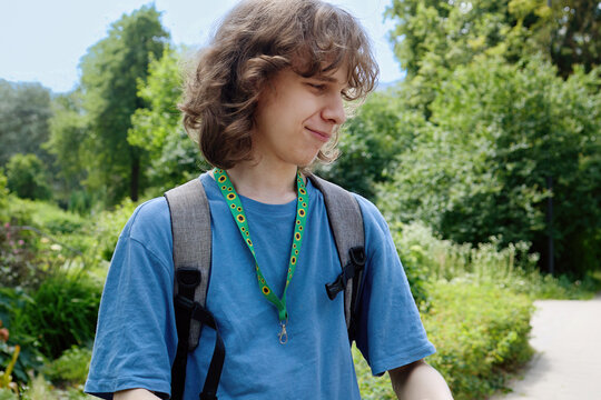 Young man wearing sunflower lanyard for hidden disability