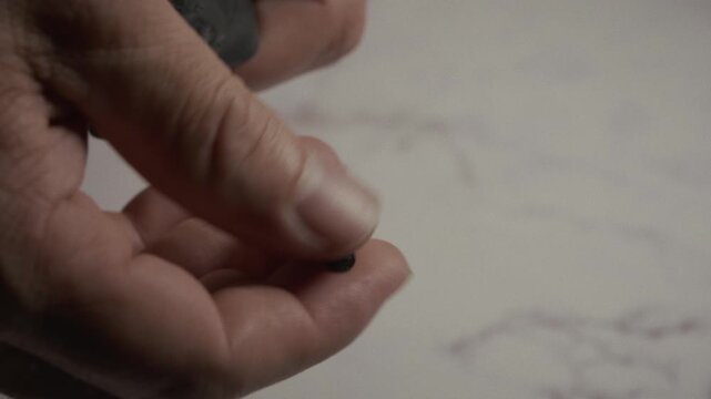 Close-Up of Unscrewing a Bicycle Tire Valve Cap