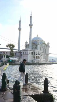 Solo Traveler by Ortakoy Mosque and Bosphorus Waterfront
