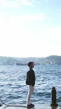 Wanderlust Travel Scene with Man Looking Across the Bosphorus