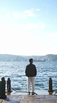 Solo Traveler Standing by the Bosphorus in Istanbul Turkey