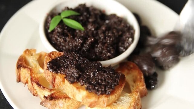 Olive tapenade appetizer black olive p&acirc;t&eacute; food preparation tasty snack fresh and delicious gourmet food background on the table rustic food top view copy space