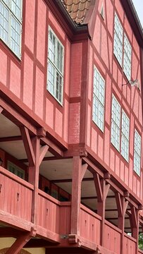 Traditional red timber-frame building architecture in Ramme, Norway