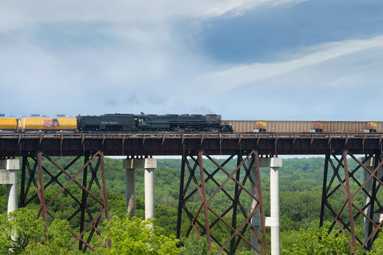BOONE IOWA USA &ndash; 5/31/2026: Big Boy and freight train pass atop Kate Shelley High Bridge