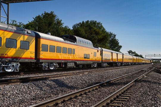 Elburn, IL - 9/9/24: Union Pacific train cars attached to Big Boy move east under light tower into Chicago - UPP 5011