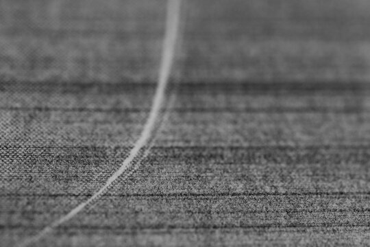 Monochrome macro shot of an inkjet print on a white piece of paper, with interesting patterns and digital textures