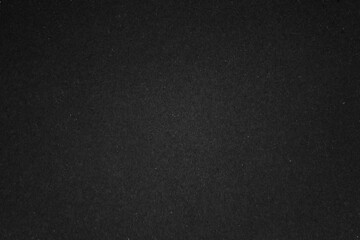 Dark textured black background with a subtle grainy style © Rawpixel.com