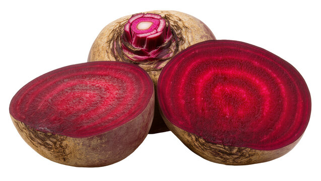 Isolated fresh vibrant beetroots cut in half and whole, showcasing rich red pulp