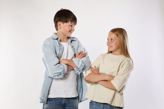 Portrait of brother and sister on white background