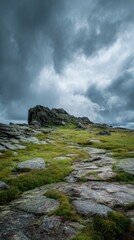 Fototapeta premium Dramatic rocky landscape under dark stormy clouds