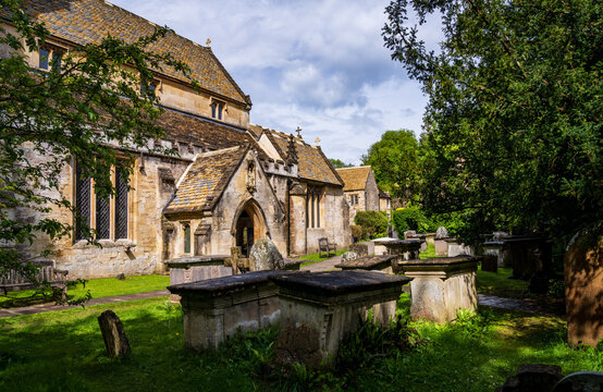 St Andrew Church in the picturesque village of Castle Combe, Wiltshire, England. Ancient graveyard with stone tombs and gravestones.