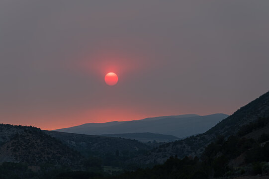 Wildfire enhanced sunset and cloudscape over Grass Valley in western Colorado on June 28, 2026.