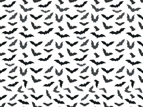 Seamless pattern of flying bats in various shades of gray on a white background, halloween.