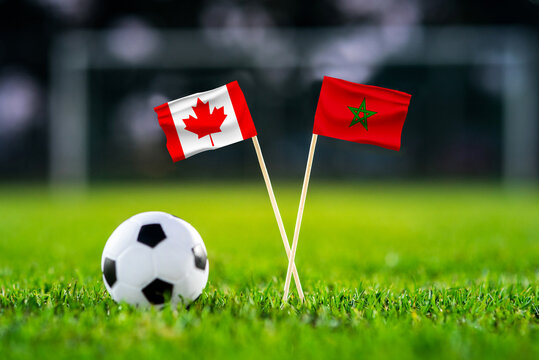 Canada vs Morocco, national flags before international football tournament Round of 16 match, football on green grass with stadium in the background, Houston, Texas, USA, July 4, 2026