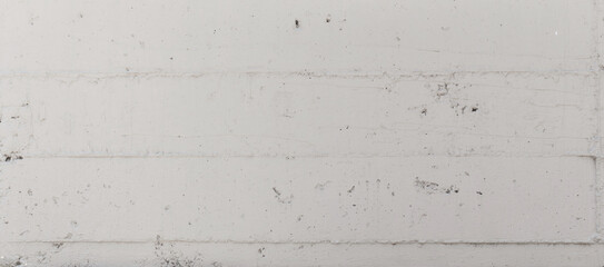 White concrete wall showing rough industrial texture © EdienuFoto
