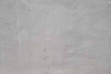 Gray concrete wall texture showing imperfections and rough surface © EdienuFoto