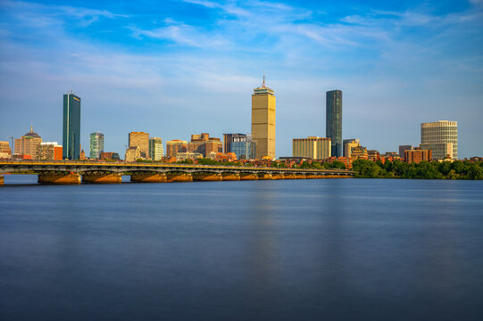 Boston Back Bay Skyline from Cambridge, with the Charles River and Harvard Bridge in the foreground in Massachusetts, USA. Long exporuse.