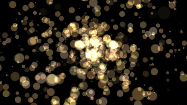 A dynamic display of golden bokeh lights with luminous particles against a dark background, creating a festive, celebratory, and abstract visual effect.