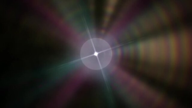 A bright central light with lens flare, radiating colorful streaks across a dark background, creating a cosmic and artistic visual effect.
