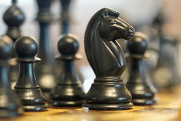 Fototapeta premium Chess pieces on a chess board 