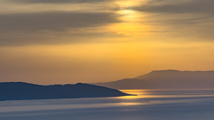 Fototapeta premium Sunset over Skopelos from Kalovoulos Peak, near Chora old town, Alonnisos Island, Greece