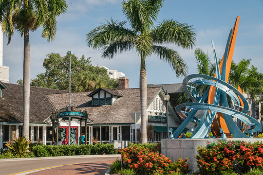 Sarasota, FL, US-May 30, 2026:   Street and public sculpture in historic downtown district with Florida Theater Studio in background.