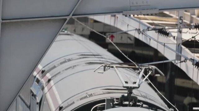 High speed electric train pantograph detail arriving at the station