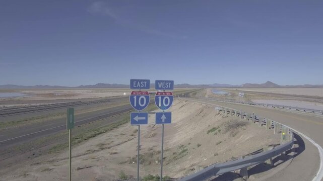 Drone Rising Above Interstate 10 East and West Highway Signs