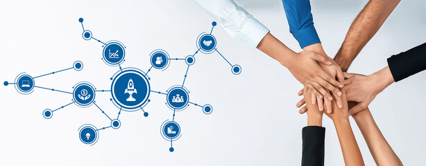 Obraz premium A diverse group of hands coming together symbolizes teamwork and collaboration. The central rocket icon illustrates innovation and growth within a business context. Amity