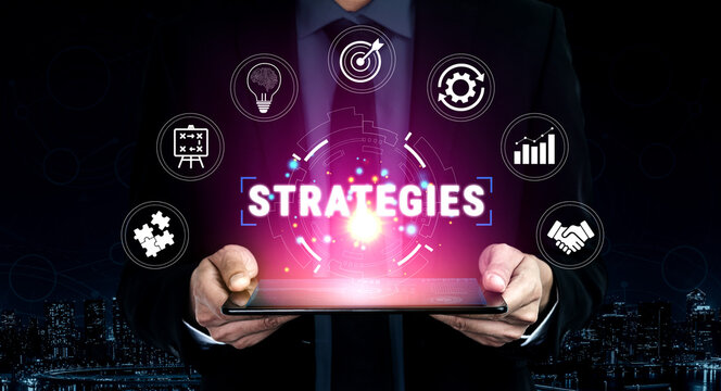 Business Strategies Concept with Icons of Innovation, Planning, and Success, Digital Tablet Held by Professional in Dark Background Quark.