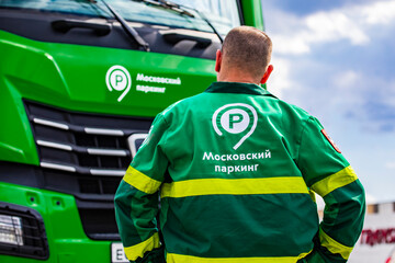 Fototapeta premium Moscow Parking Service employee at a special vehicle on Moscow Street