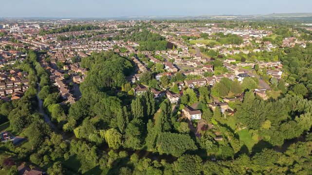 Aerial drone footage of the Okus area, the restored Swindon Canal corridor, and Old Town in Swindon, Wiltshire, England, featuring residential neighbourhoods