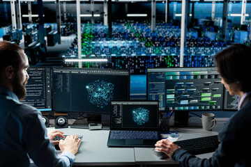 Fototapeta premium Computing facility technicians tracking AI applications, refining machine learning parameters with teamworking computing hub staff members collaborating, enhancing AI software operational performance.