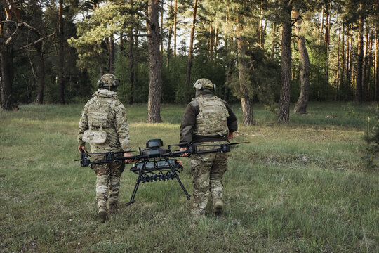 Ukrainian military pilots carrying large uav drone