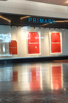 Alicante, Spain - June 30, 2026: Primark Store Window with Red Discount Signs. Primark is international clothing retailer famous for selling fashion and homeware at very low prices