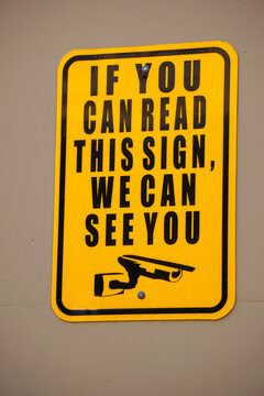 Security camera watching you sign