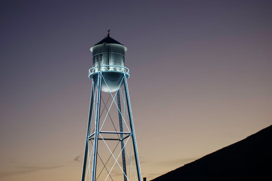 Vintage water tower at night in Gilbert Arizona