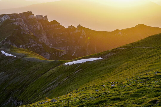 mountain landscape with fog, sunset from Omu Peak, Bucegi Mountains, Romania 
