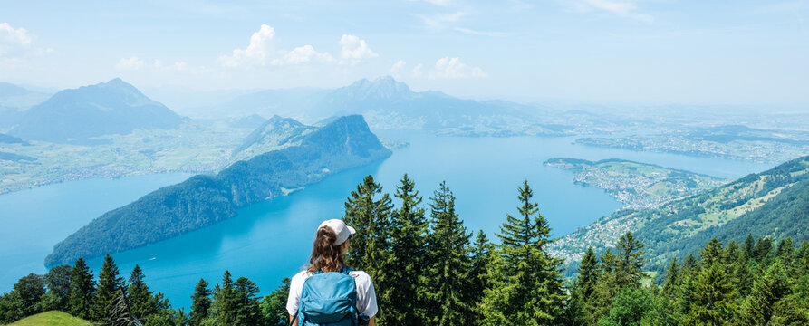 Hiker enjoying panoramic view of lake lucerne and mount rigi