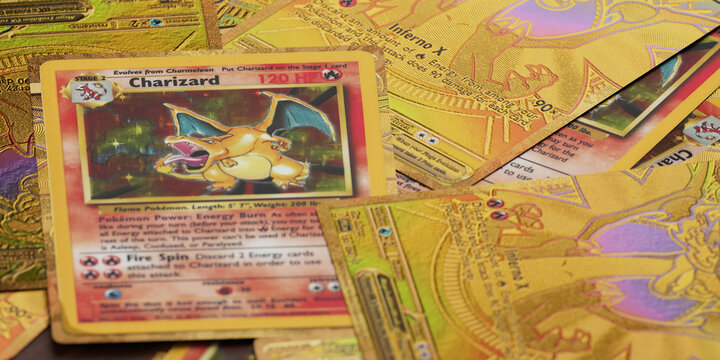 pile of ultra rare charizard base set pokemon cards, english tcg version