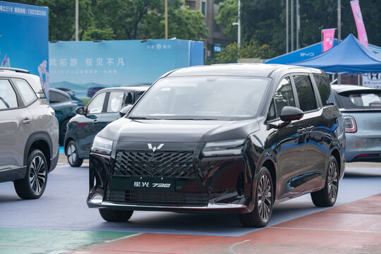 ZHONGSHAN GUANGDONG China-Aprill 11 2026: a glossy black Wuling Starlight 730 family MPV car.