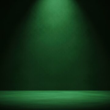 Empty studio room with dark green textured wall and floor illuminated by a single overhead spotlight from the top center, creating a dramatic stage background for product display.