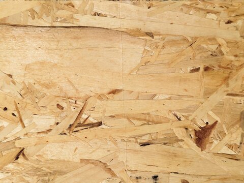 OSB board wood chip texture background for construction material