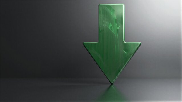 Green arrow points down on dark surface, symbolizing decline or downward trend.