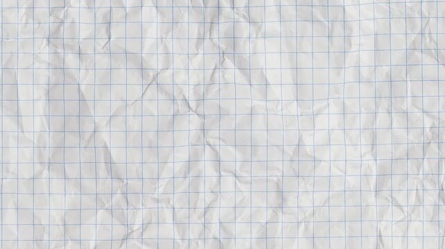 Blank sheet of crumpled white graph paper. grunge crumpled white paper texture. wrinkled paper motion