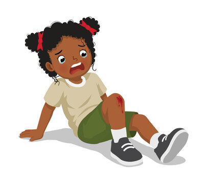 Little African girl has knee injury after falling down scratching her knee bleeding
