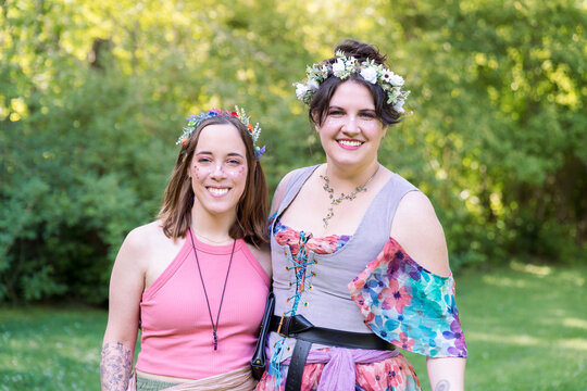 Women standing together wearing colorful ren faire outfits