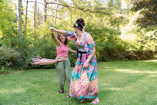 Women dancing in ren faire outfits