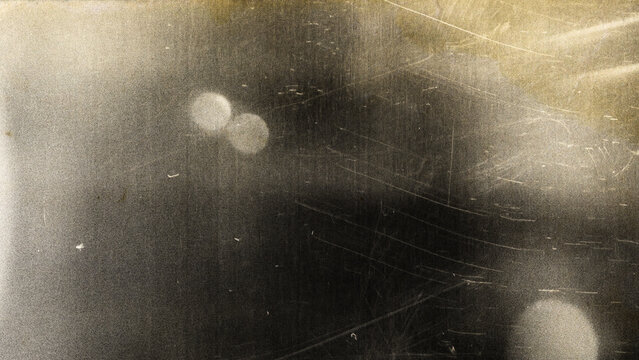 Retro noisy analogue effect ideal for overlays. Abstract light leak overlay with colorful film burn effects. Dark abstract texture background with cinematic film grain and light dust.