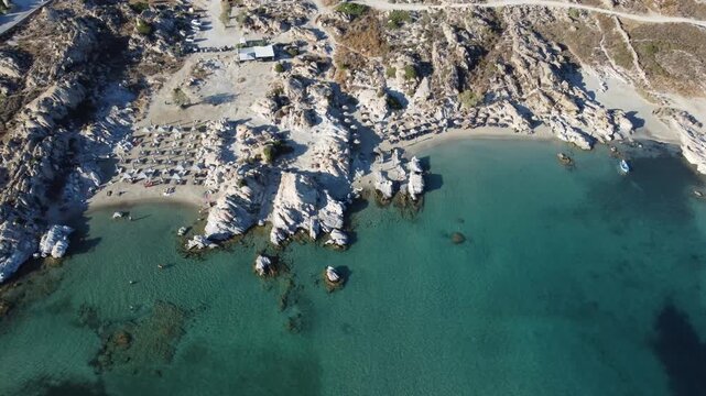Kolymbithres Beach granite rocks, coves and pools in sunny daylight in summer, Paros, Drone shot